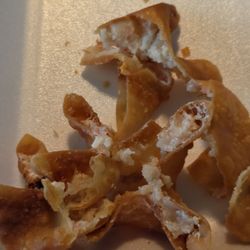 Disgusting cream cheese wontons they're stale there's no cream cheese and I'm not even sure what that white stuff is sticking out of it