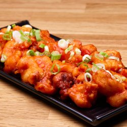 Crispy cauliflower florets tossed in a bold, tangy Manchurian sauce and finished with fresh green onions -- our Gobi Manchurian.