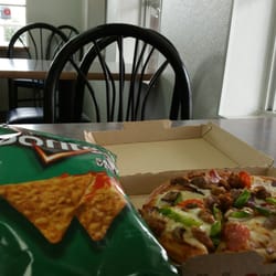 Manvel Exxon - Mini Pizza Hut and seating area within.