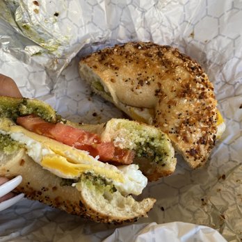 Coffee Talk - a hand holding a half eaten sandwich - Coffee & Tea Near Me - Stone Harbor, New Jersey
