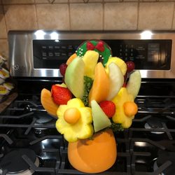 Edible Arrangements - Paid extra money to have the two undistinguishable pineapple blobs added to this bouquet and no call back from the store manager.