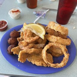 Shrimp, fish, stuffed crab, and onion rings. Shrimp, fish, stuffed crab, and onion rings.