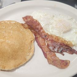 La Botana Grill - The breakfast plate. 1 pancake 2 eggs 2 bacon. Price is right.