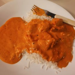 Pink Garlic Indian Cuisine - Half of the butter chicken and rice