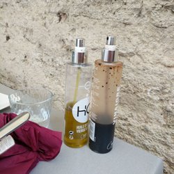 La Pomme d'Amour - Dirty bottles with olive oil and vinegar.