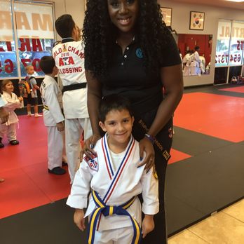 Legend Martial Arts - Cole and Ms. Johnson at the belt promotion ceremony. - Taekwondo Near Me - Windermere, Florida Legend Martial Arts - Cole and Ms. Johnson at the belt promotion ceremony. - Taekwondo Near Me - Windermere, Florida