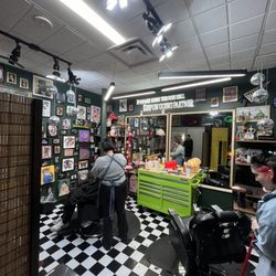 Clockwork Barbershop - Styling area with lots of cool art