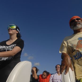 Hold Tight Boat Tours - a man and a woman on a boat - Boat Tours Near Me - Palm City, Florida Hold Tight Boat Tours - a man and a woman on a boat - Boat Tours Near Me - Palm City, Florida