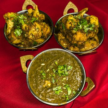India Garden - three bowls of food on a red cloth - Indian Near Me - Bloomington, Indiana India Garden - three bowls of food on a red cloth - Indian Near Me - Bloomington, Indiana