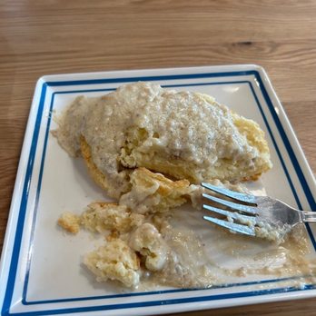 Biscuit Belly - Hoover - Biscuit and gravy (half eaten). Excellent - Breakfast & Brunch Near Me - Hoover, Alabama