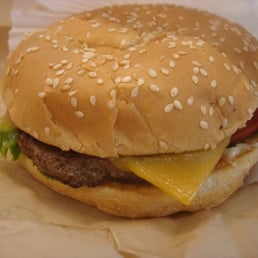 a hamburger with cheese and lettuce a hamburger with cheese and lettuce