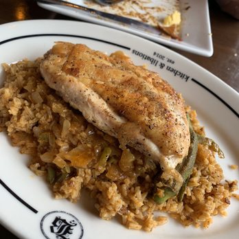 Bosscat Kitchen & Libations - Cajun brick chicken with "dirty rice" pretty much jambalaya - New American Near Me - Houston, Texas