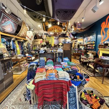 DreamWeaver - A boutique store interior displays clothing, hats, and accessories on racks and tables, with decorative textiles hanging from the ceiling. - Accessories Near Me - Berlin, Maryland