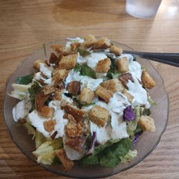 Salad with blue cheese dressing and croutons.