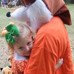 daughter hugging a wolf character daughter hugging a wolf character