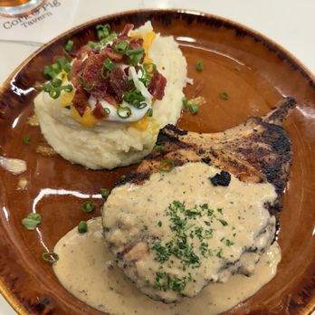 Cork & Pig Tavern - Double Cut Pork Chop with loaded mashed potatoes - New American Near Me - Irving, Texas Cork & Pig Tavern - Double Cut Pork Chop with loaded mashed potatoes - New American Near Me - Irving, Texas