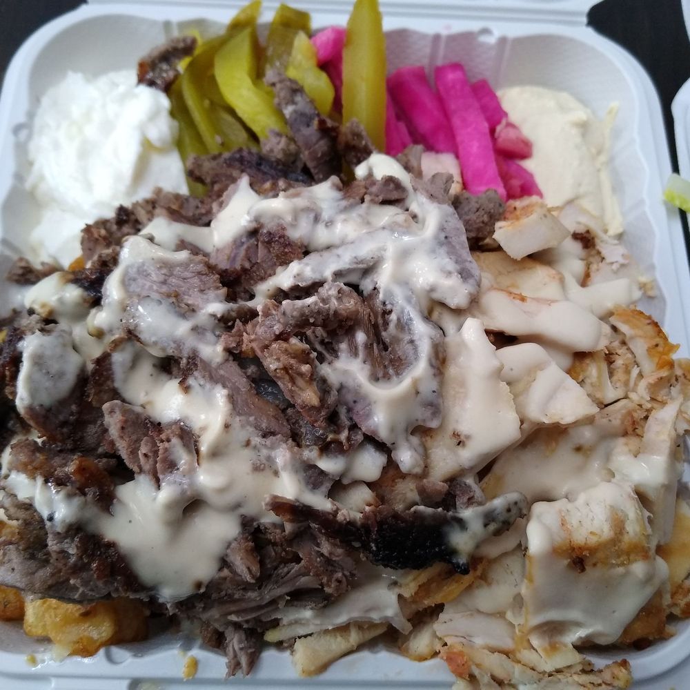 Lebanese Palace - Closeup of the mixed shawarma platter. There is rice and potatoes underneath the meat. - Lebanese Near Me - Ottawa, Ontario Lebanese Palace - Closeup of the mixed shawarma platter. There is rice and potatoes underneath the meat. - Lebanese Near Me - Ottawa, Ontario