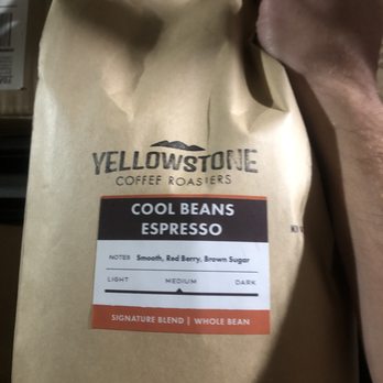 Cool Beans Espresso - a person holding a bag of coffee - Coffee & Tea Near Me - Bozeman, Montana