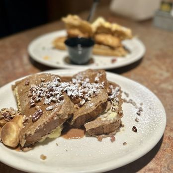 Huckleberry's - Banana Foster Stuffed French Toast and Stacked Chicken & Waffles - Breakfast & Brunch Near Me - Roseville, California Huckleberry's - Banana Foster Stuffed French Toast and Stacked Chicken & Waffles - Breakfast & Brunch Near Me - Roseville, California
