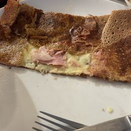 Half of a jambon et fromage (ham and cheese) crepe. Very tasty. Half of a jambon et fromage (ham and cheese) crepe. Very tasty.