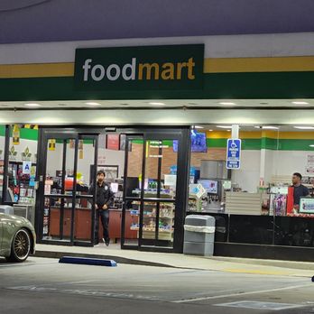 Conserv Fuel - a car parked in front of a food mart - Car Wash Near Me - Riverside, California