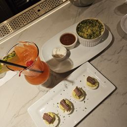 Deviled eggs topped with brisket and alfredo spinach dip and the River Runner cocktail - DELISH!!
