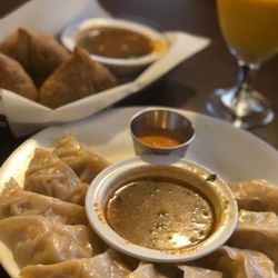 Nepali Kitchen - Chicken momo to share. Great Samosas in the background