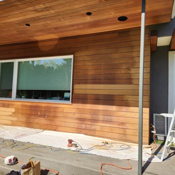 TJ'S CUSTOM BUILDING & REMODELING - wood siding being installed - General Contractors Near Me