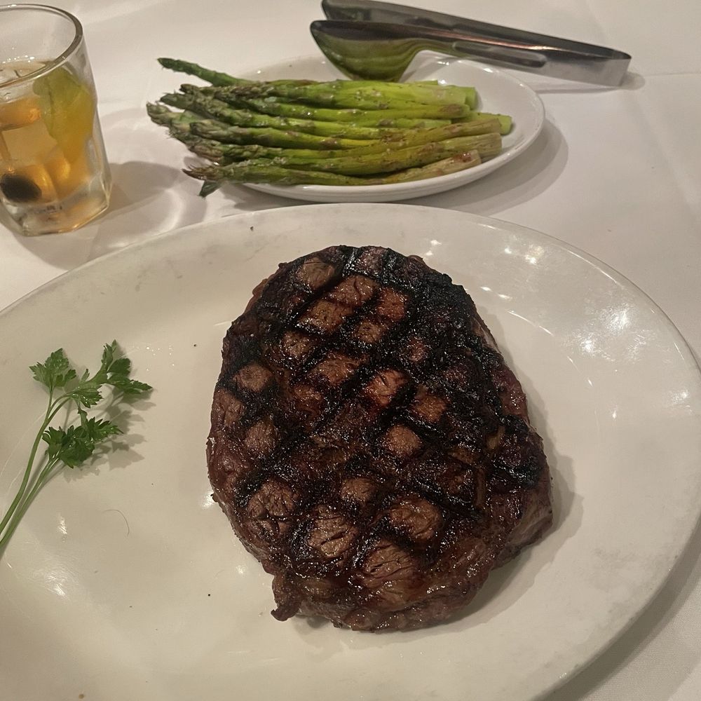 St. Elmo Steak House - Ribeye with roasted asparagus which - Steakhouses Near Me - Indianapolis, Indiana St. Elmo Steak House - Ribeye with roasted asparagus which - Steakhouses Near Me - Indianapolis, Indiana