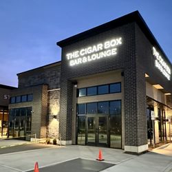 The Cigar Box Bar & Lounge - Exterior view. Located less than a mile from Grand Park at 191st St and Chatham Commons Boulevard.