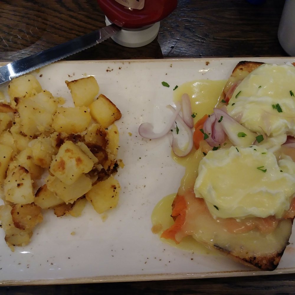 First Watch - Eggs benedict with smoked salmon served with a side order of potatoes - Breakfast & Brunch Near Me - Jacksonville, Florida