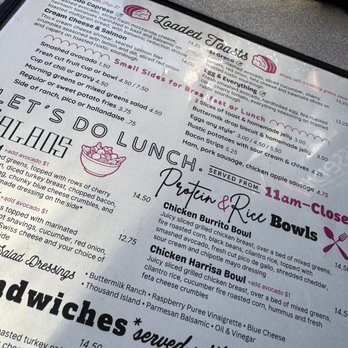 Jelly - The menu from Loaded Tacos features sections for breakfast and lunch, listing items such as smashed avocado toast, salmon dishes, and chicken bowls. It includes details about ingredients, preparation styles, and prices, with some items marked as served from 11 am to close. The menu is printed on a paper sheet with a decorative logo and colorful text, and it emphasizes options served with sides like avocado and salad dressings. - New American Near Me - Denver, Colorado