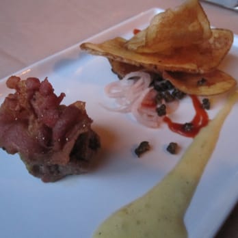 Rainbow Lodge - Buffalo tartar with crispy prosciutto, potato chips and siracha and a dijon sauce - New American Near Me - Houston, Texas Rainbow Lodge - Buffalo tartar with crispy prosciutto, potato chips and siracha and a dijon sauce - New American Near Me - Houston, Texas