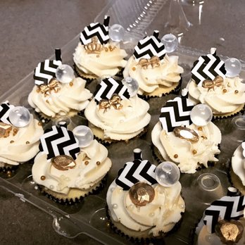XO Cakery - a tray of cupcakes with white frosting and black and white chevrons - Cupcakes Near Me XO Cakery - a tray of cupcakes with white frosting and black and white chevrons - Cupcakes Near Me