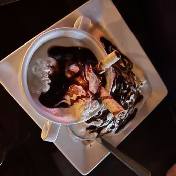 The Purple Door - a bowl of ice cream and chocolate sauce - New American Near Me - Harlan, Iowa