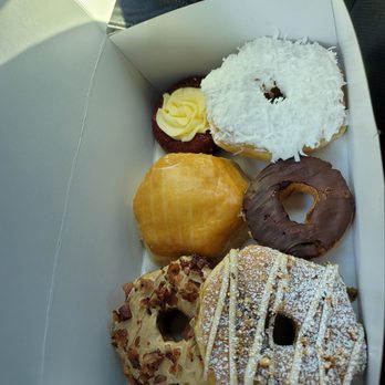 The Heavenly Donut - From the bottom left- up, over. And around- Bacon Maple, Nutella Filled, Red Velvet, Coconut, chocolate sour cream classic, and French Toast - Donuts Near Me - Birmingham, Alabama