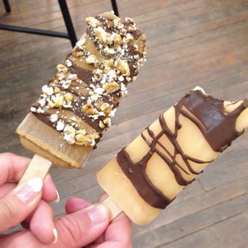 Popbar - Coffee with dark chocolate and caramel corn on the left and grapefruit with dark chocolate on the right - Desserts Near Me - Anaheim, California Popbar - Coffee with dark chocolate and caramel corn on the left and grapefruit with dark chocolate on the right - Desserts Near Me - Anaheim, California