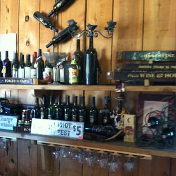 Crystal Basin Cellars - Behind the non wine club members bar. Tons of signs and knick knacks to look at everywhere! - Wineries Near Me - Camino, California
