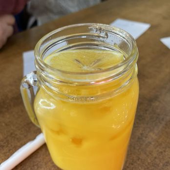 The Corner Cafe - Orange juice comes garnished with a slice of lemon - British Near Me - London, XGL The Corner Cafe - Orange juice comes garnished with a slice of lemon - British Near Me - London, XGL