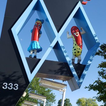 Superdawg Drive-In - The iconic dancing anthropomorphic hot dogs are 'Flaurie' and 'Maurie', named after the founders of Superdawg - Hot Dogs Near Me - Wheeling, Illinois