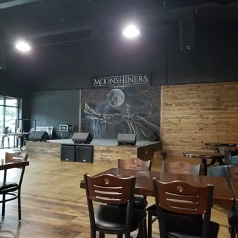 Moonshiners Bar & Grill - Stage with custom artwork - Sports Bars Near Me - Braselton, Georgia Moonshiners Bar & Grill - Stage with custom artwork - Sports Bars Near Me - Braselton, Georgia