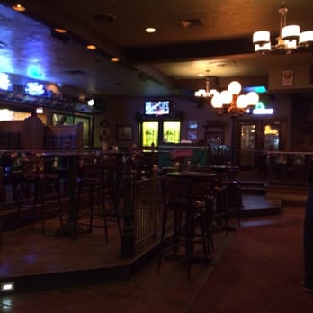 Bonzzini's Brew Pub - a man sitting at a bar - Pubs Near Me - Regina, Saskatchewan Bonzzini's Brew Pub - a man sitting at a bar - Pubs Near Me - Regina, Saskatchewan