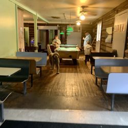 Cabin Restaurant & Lounge - The boys playing pool with the Cabin Dog, Winston.