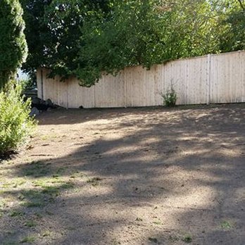 NRI Landscaping - a backyard with a fenced in area - Landscaping Near Me - Cumberland, Rhode Island NRI Landscaping - a backyard with a fenced in area - Landscaping Near Me - Cumberland, Rhode Island