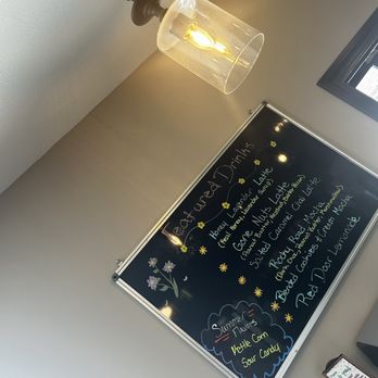 Red Door Coffee - a chalkboard with a menu on it - Coffee & Tea Near Me - West Point, Nebraska