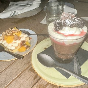 UP On The Roof - JUST PEACHY: tres leches cake, peaches, candied pecans; CHOCOLATE PANNA COTTA: fresh berries, raspberry coulis, brookie - Cocktail Bars Near Me - Anderson, South Carolina