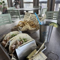 Fried shrimp tacos and Cuban fries. Skip the ketchup and enjoy the cilantro dip