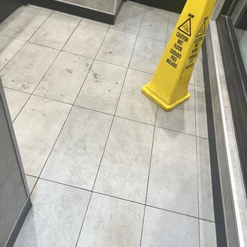 McDonald's - a caution sign on the floor - Fast Food Near Me - St. Cloud, Minnesota