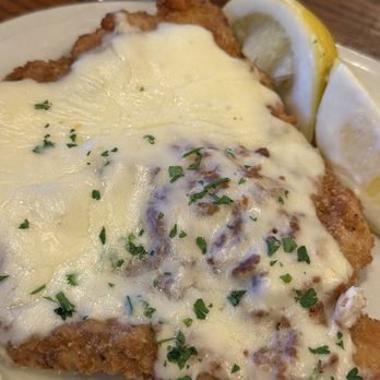 Metzger's German Restaurant - Copenhagen Schnitzel - a swiss cheese and sour cream sauce on their classic - German Near Me - Ann Arbor, Michigan