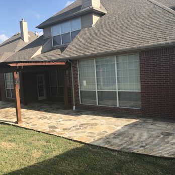 R&O Landscape Services - a brick patio with a pergol roof - Lawn Services Near Me